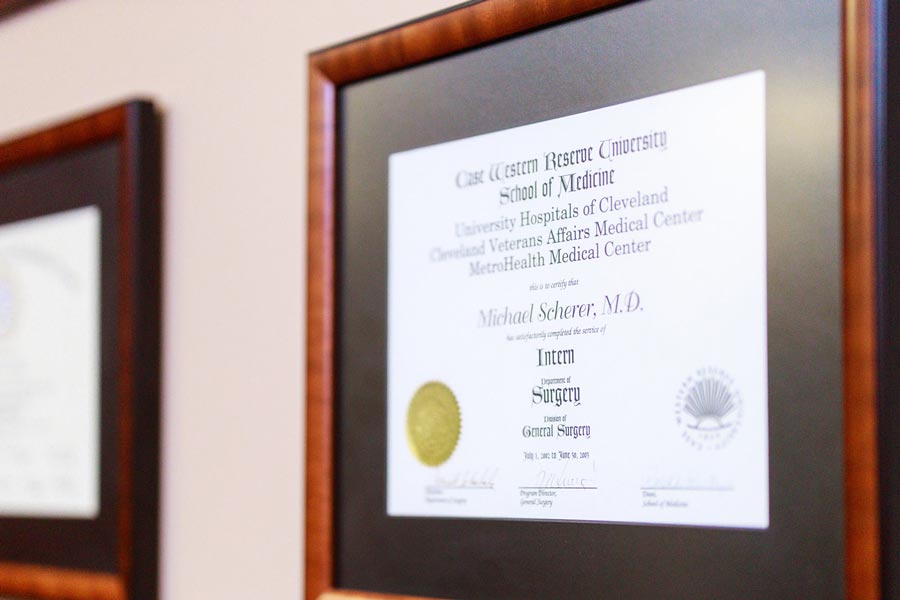 Framed diplomas on wall at Wheaton Oral Surgery in Naperville, IL