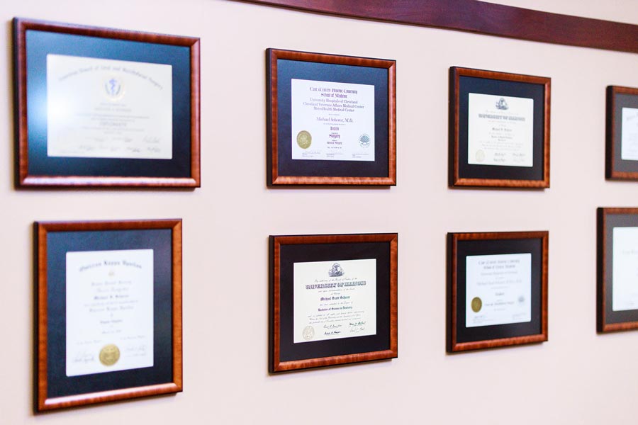 Framed degrees on wall at Wheaton Oral Surgery in Naperville, IL