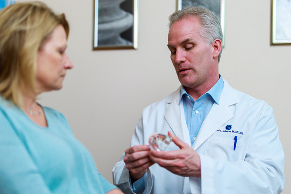 Dr. Scherer speaking to patient at Wheaton Oral Surgery in Naperville, IL