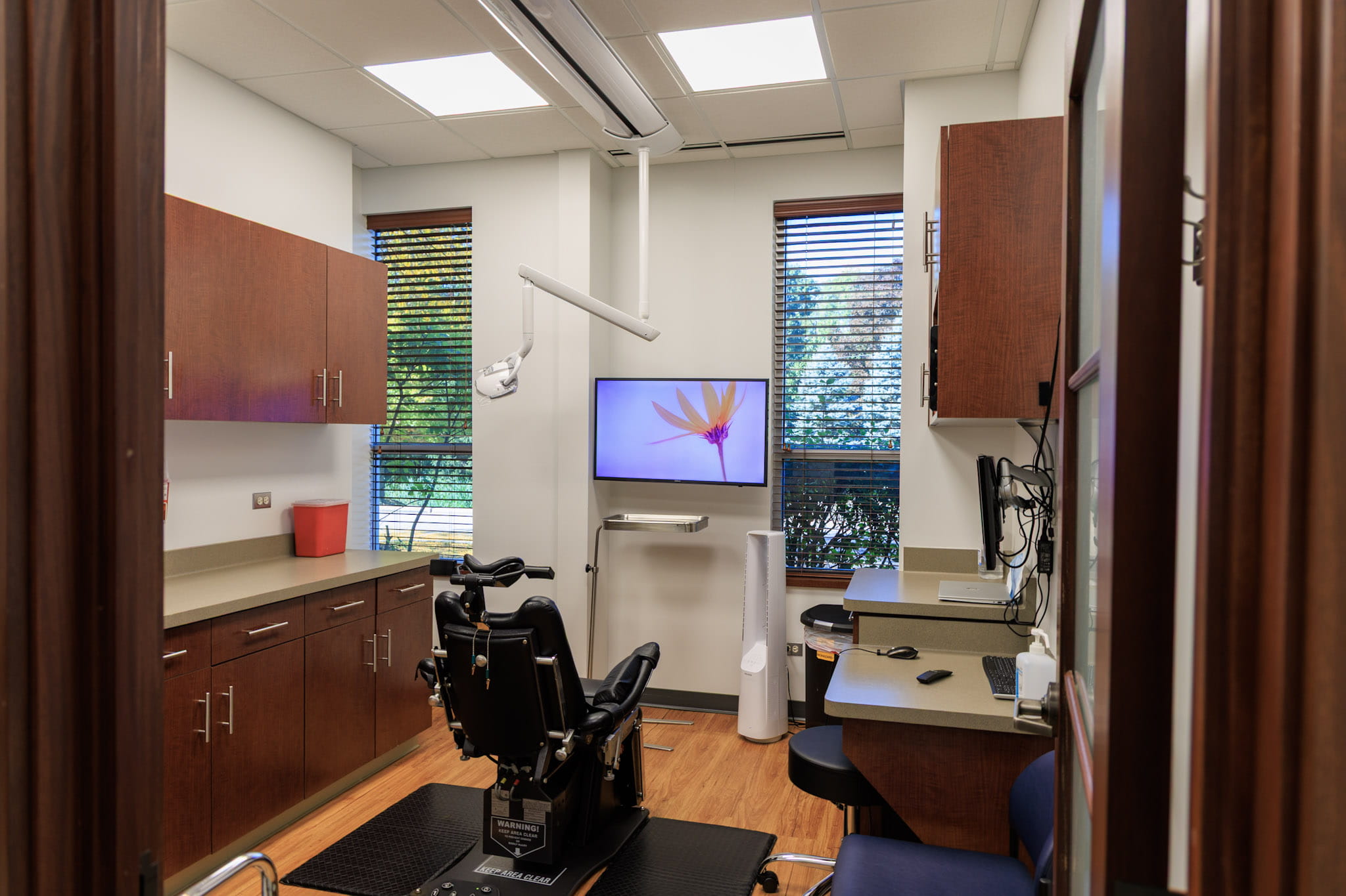 Dental exam chair in exam room at Wheaton Oral Surgery in Naperville, IL